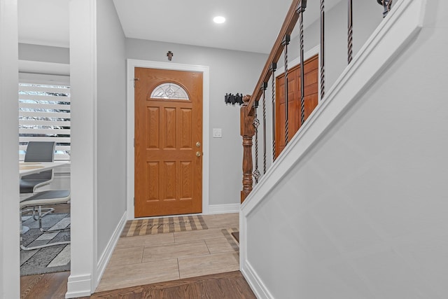 entrance foyer with stairway, recessed lighting, and baseboards