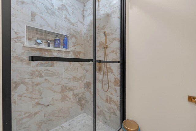 bathroom with a shower stall