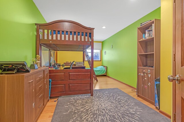 bedroom featuring light wood-type flooring and baseboards