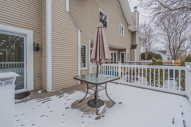 view of snow covered deck