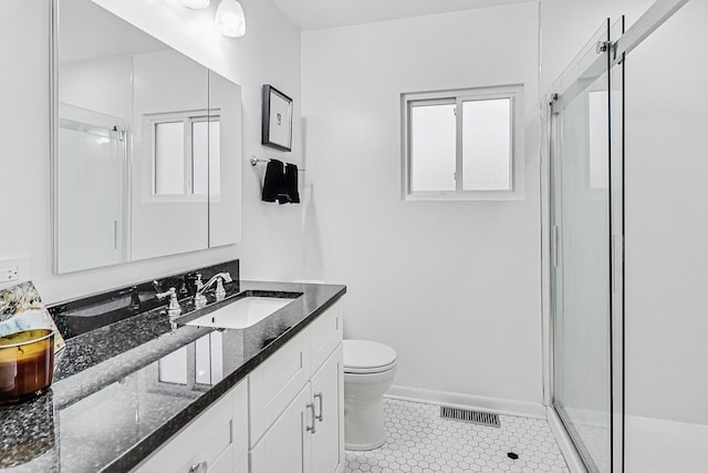 full bathroom with a stall shower, visible vents, and toilet