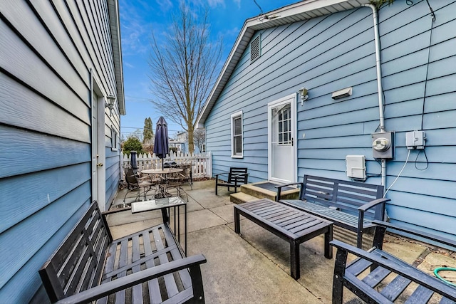 view of patio featuring outdoor dining area