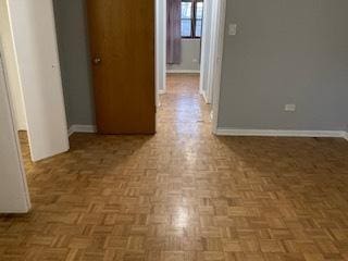 interior space featuring baseboards