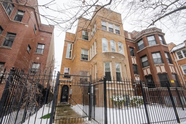 view of building exterior with a fenced front yard