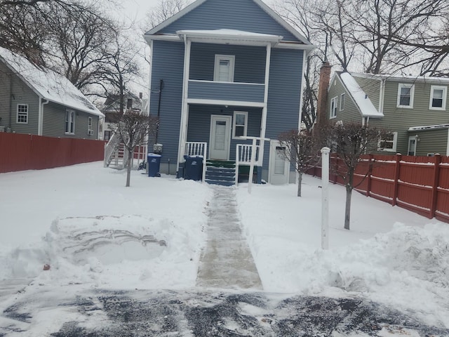 view of front of house with fence