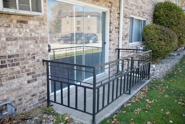 property entrance with brick siding