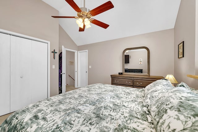 bedroom with ceiling fan, high vaulted ceiling, and a closet