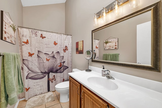 bathroom featuring vanity, toilet, and tile patterned floors