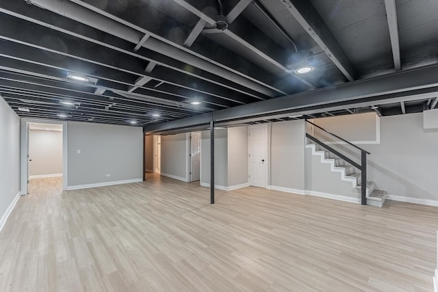 basement featuring baseboards, recessed lighting, and dark wood-type flooring