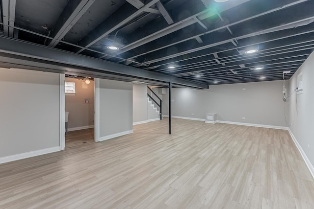 unfurnished bedroom with baseboards, visible vents, wood finished floors, and a closet