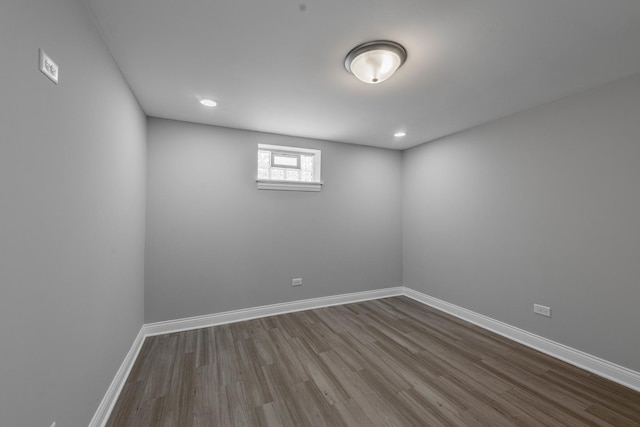 full bath with a tile shower, vanity, toilet, marble finish floor, and baseboards