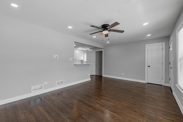 empty room featuring visible vents, recessed lighting, ceiling fan, and dark wood-style floors