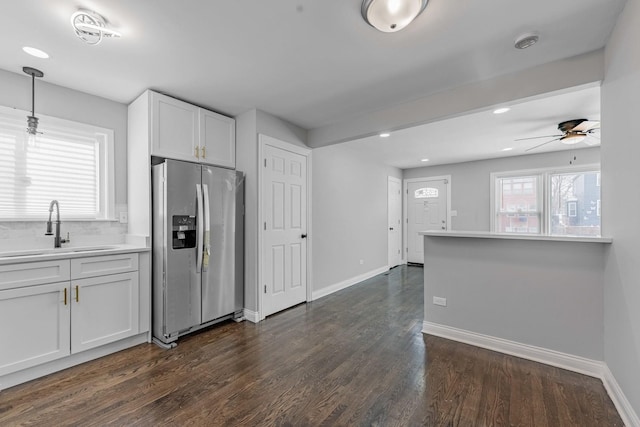 corridor with recessed lighting, baseboards, and dark wood-style flooring