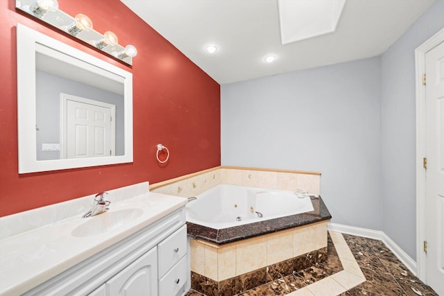 bathroom with a whirlpool tub, recessed lighting, vanity, and baseboards