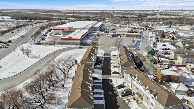 snowy aerial view with a residential view