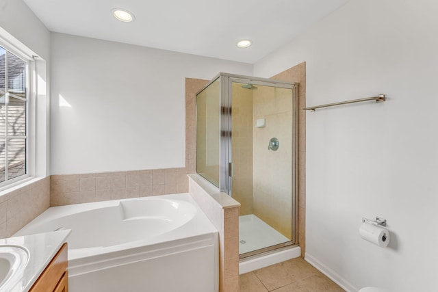 full bathroom featuring a shower stall, plenty of natural light, and tile patterned flooring