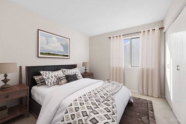 carpeted bedroom with a closet