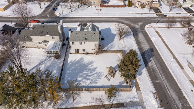 snowy aerial view with a residential view