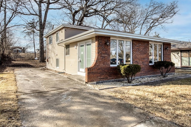 view of front of home with brick siding