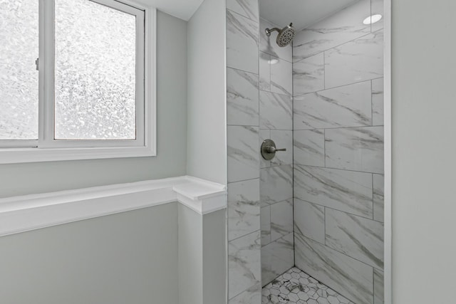 full bath featuring a tile shower