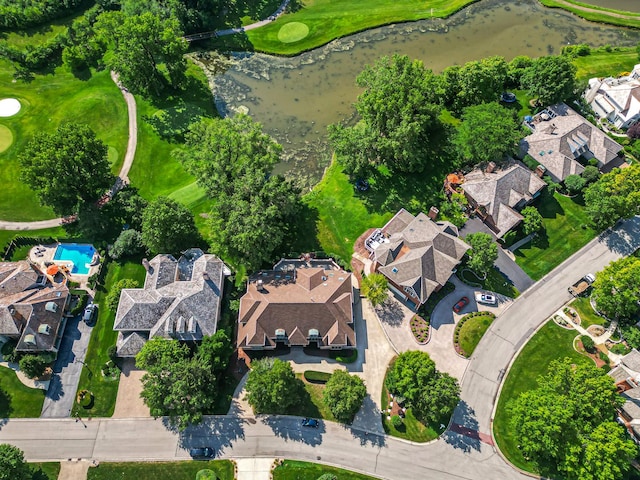 aerial view with view of golf course, a water view, and a residential view