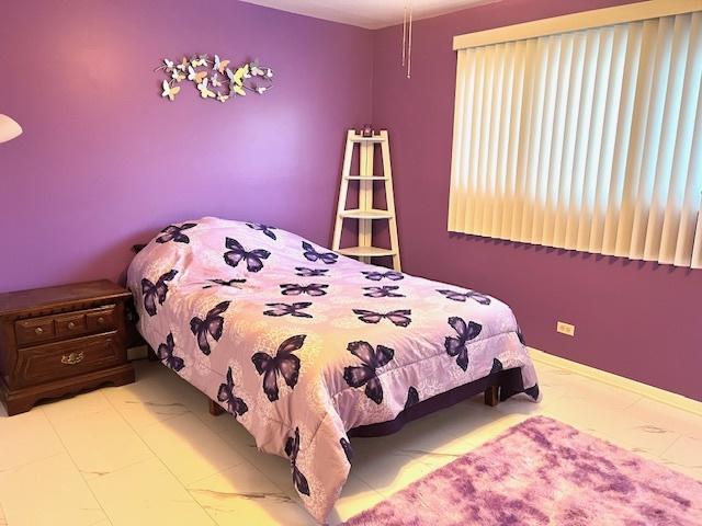 bedroom with marble finish floor