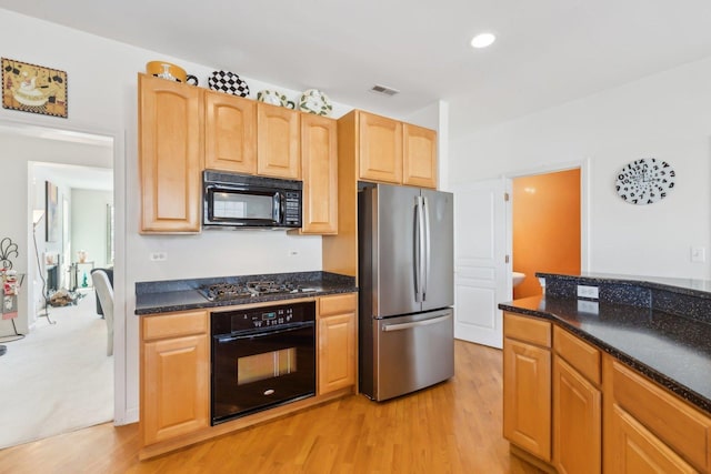 kitchen featuring visible vents, light wood-type flooring, black appliances, light brown cabinets, and recessed lighting