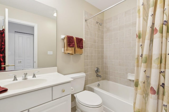 full bathroom featuring toilet, shower / bathtub combination with curtain, and vanity