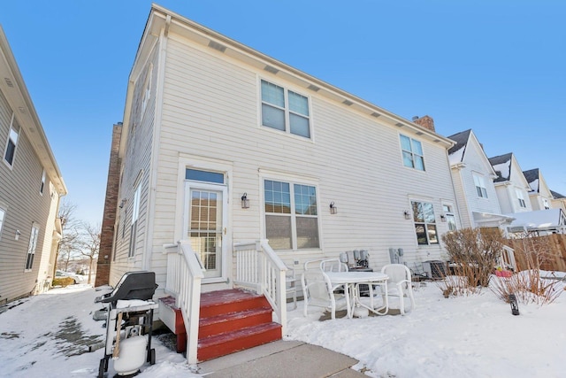 view of snow covered house