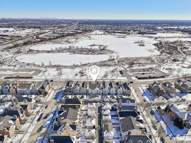 snowy aerial view featuring a residential view