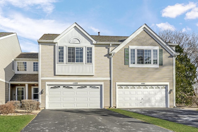 view of front of home with driveway and an attached garage