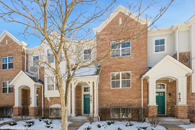 view of property with brick siding