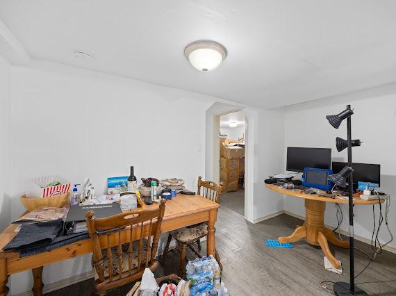 office with baseboards and wood finished floors