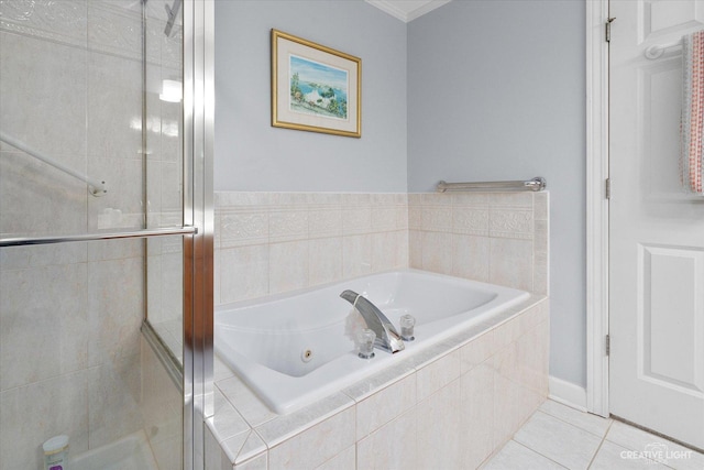 full bath with a shower stall, a bath, and tile patterned floors