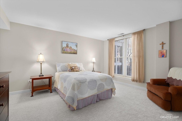 bedroom featuring light carpet, visible vents, and baseboards