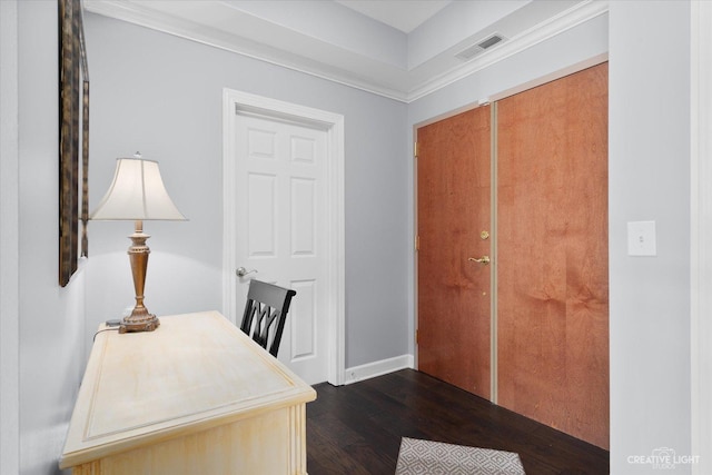 office featuring dark wood-type flooring, visible vents, and baseboards