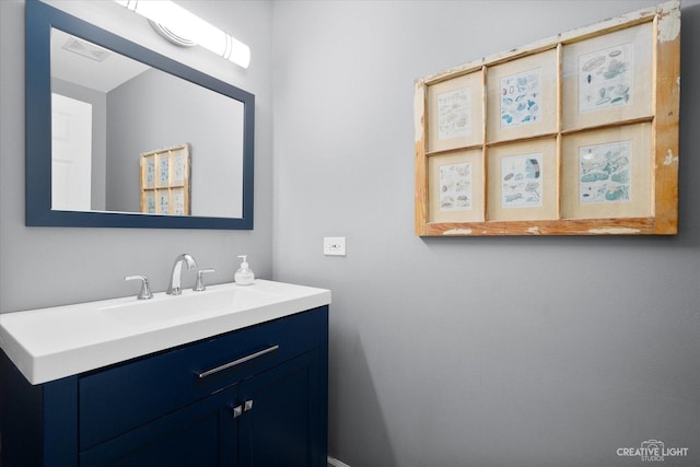 bathroom with visible vents and vanity