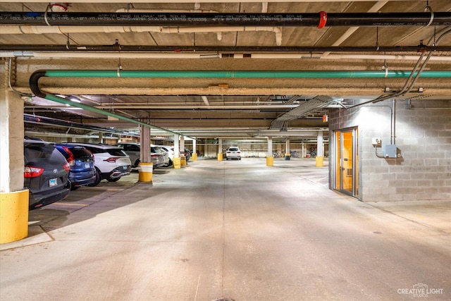 parking deck featuring concrete block wall