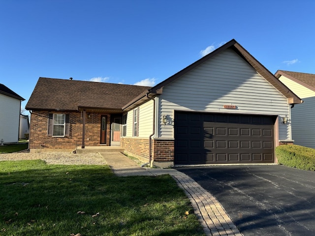 ranch-style house with a garage, driveway, brick siding, a porch, and a front yard