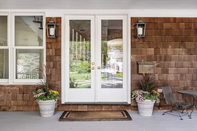 view of exterior entry featuring french doors