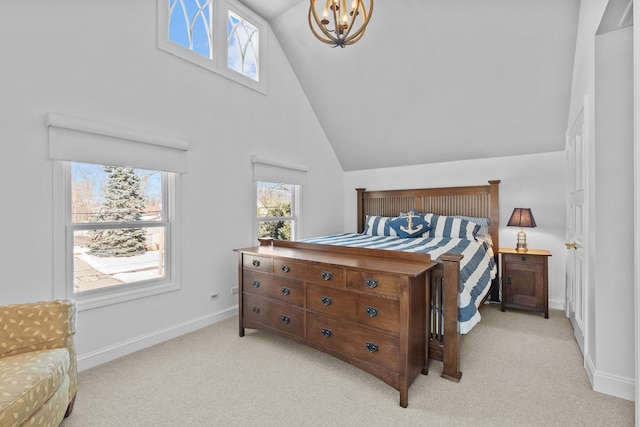 bedroom featuring an inviting chandelier, multiple windows, and light colored carpet