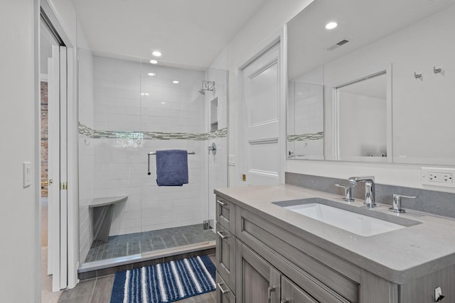 full bath featuring recessed lighting, visible vents, a shower stall, and vanity