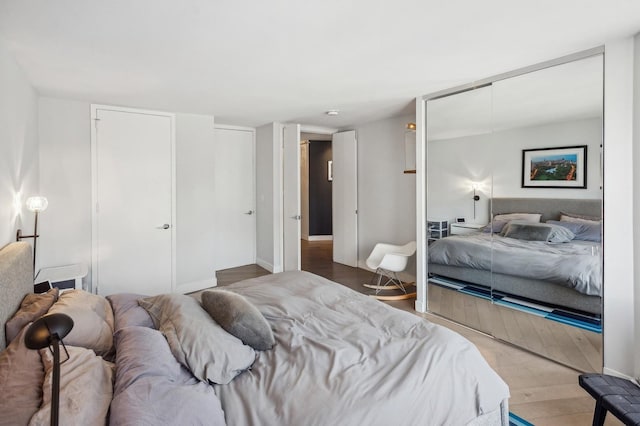 bedroom with wood finished floors