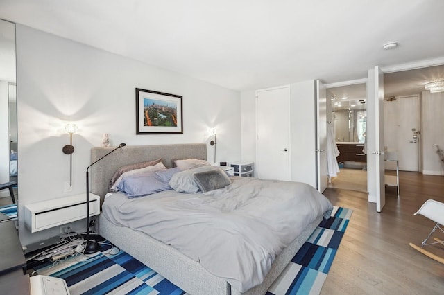 bedroom featuring light wood-style flooring