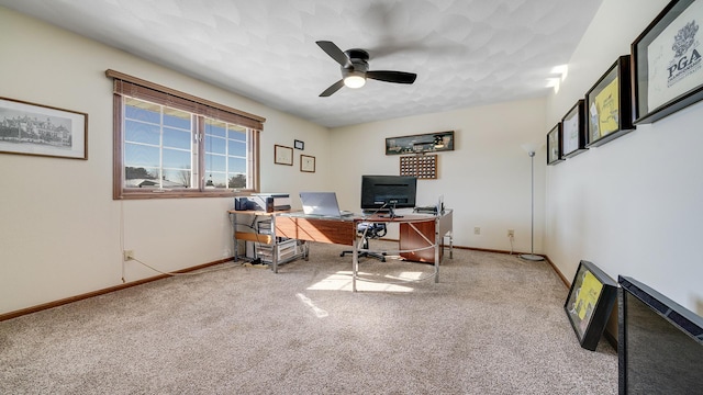 office with carpet floors, ceiling fan, and baseboards