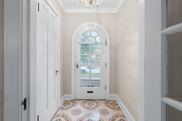 doorway featuring arched walkways, a chandelier, light tile patterned flooring, baseboards, and ornamental molding