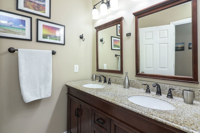 bathroom featuring double vanity and a sink