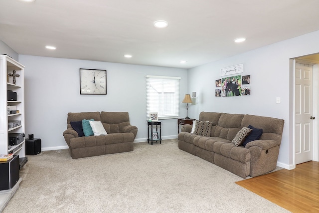 carpeted living room featuring recessed lighting and baseboards