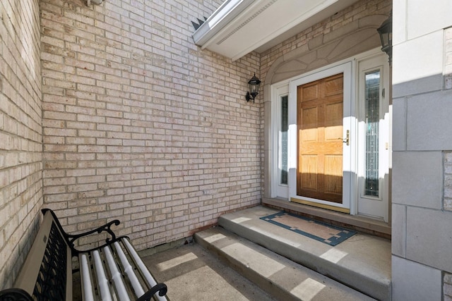 property entrance with brick siding