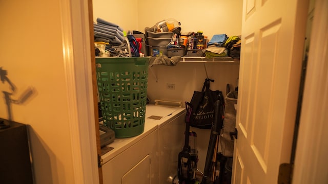 washroom featuring laundry area and washer and clothes dryer